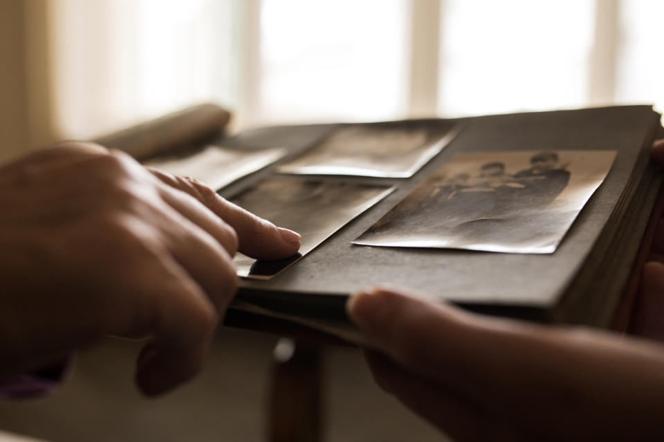 People looking at a photo album