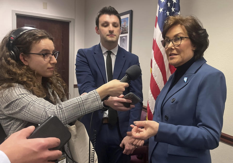 U.S. Sen. Jacky Rosen, right, speaks with local media shortly after her speech at the Nevada Legislature in Carson City, Nev., Monday, April 3, 2023. Rosen, a Democrat from Nevada who steered a moderate path during her first term in the chamber, announced Wednesday, April 5, 2023, that she will seek reelection in the perennial battleground state. (AP Photo/Gabe Stern)