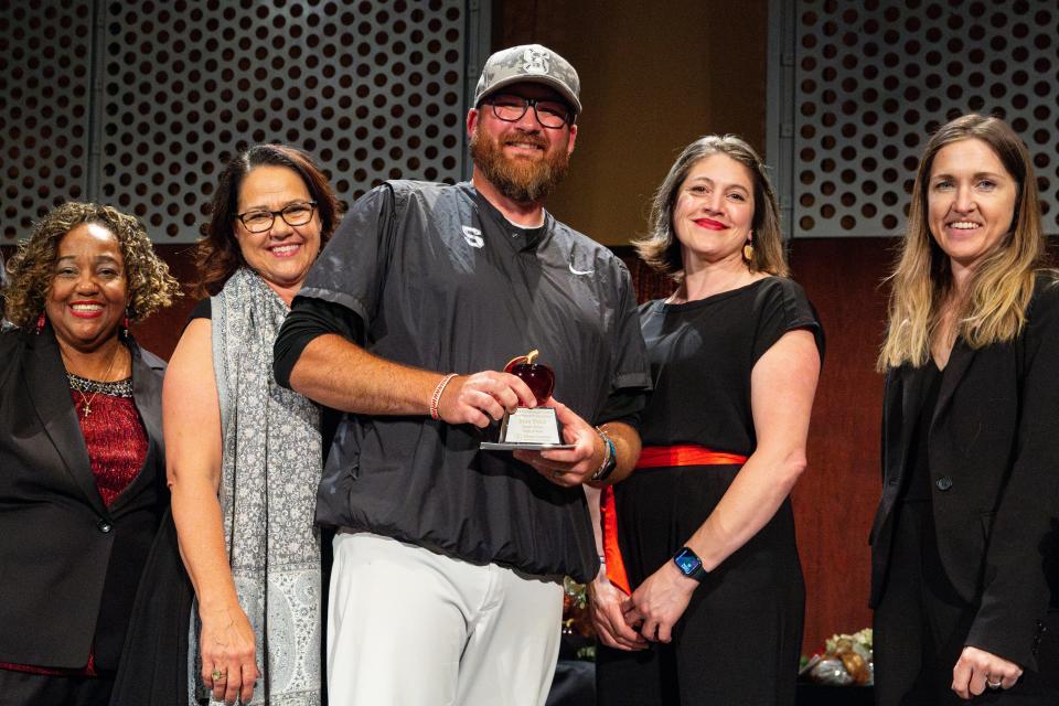 Max Price, a teacher at South Salem High School is awarded a Crystal Apple during the 25th annual Crystal Apple Awards at the Salem Convention Center on Wednesday in Salem.