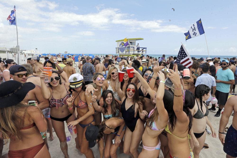 In this Monday, March 14, 2016, file photo, college students have fun during their spring break in South Beach, at Miami Beach, Fla. (AP Photo/Alan Diaz, File)