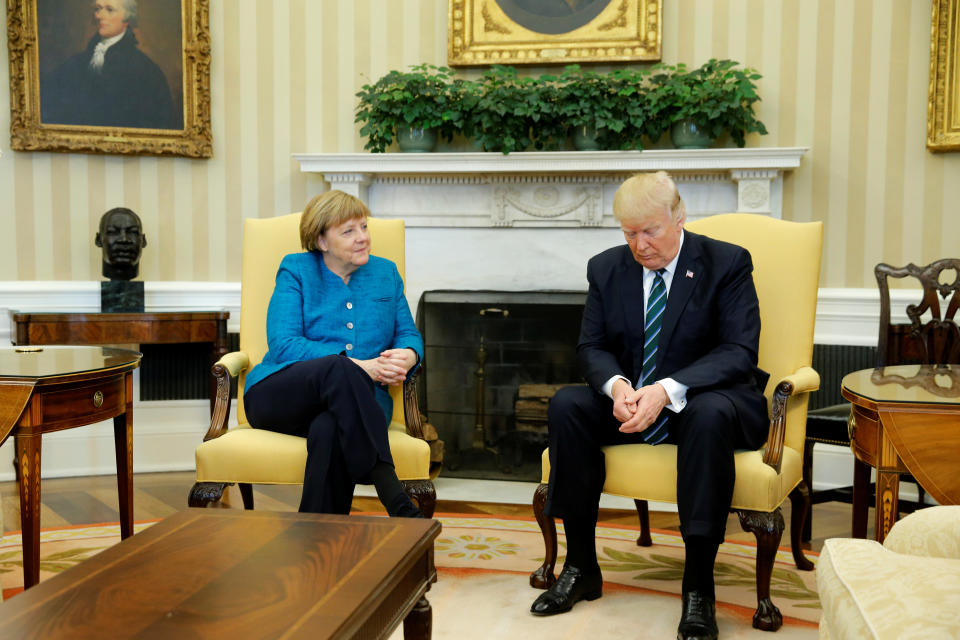 Trump and German Chancellor Angela Merkel wait for reporters to enter the room before their meeting in the Oval Office&nbsp;on March 17.