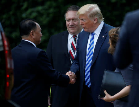 North Korean envoy Kim Yong Chol shakes hands with U.S. President Donald Trump as Secretary of State Mike Pompeo looks on after a meeting at the White House in Washington, U.S., June 1, 2018. REUTERS/Leah Millis