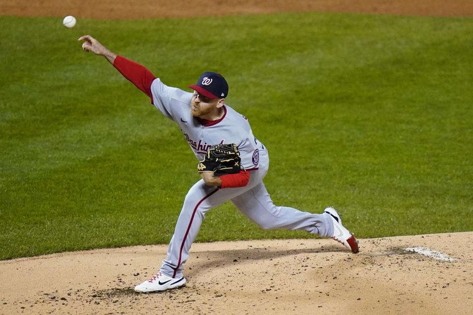Washington Nationals' Reed Garrett pitches during the first inning in the second baseball game of the team's doubleheader against the New York Mets, Tuesday, Oct. 4, 2022, in New York. (AP Photo/Frank Franklin II)