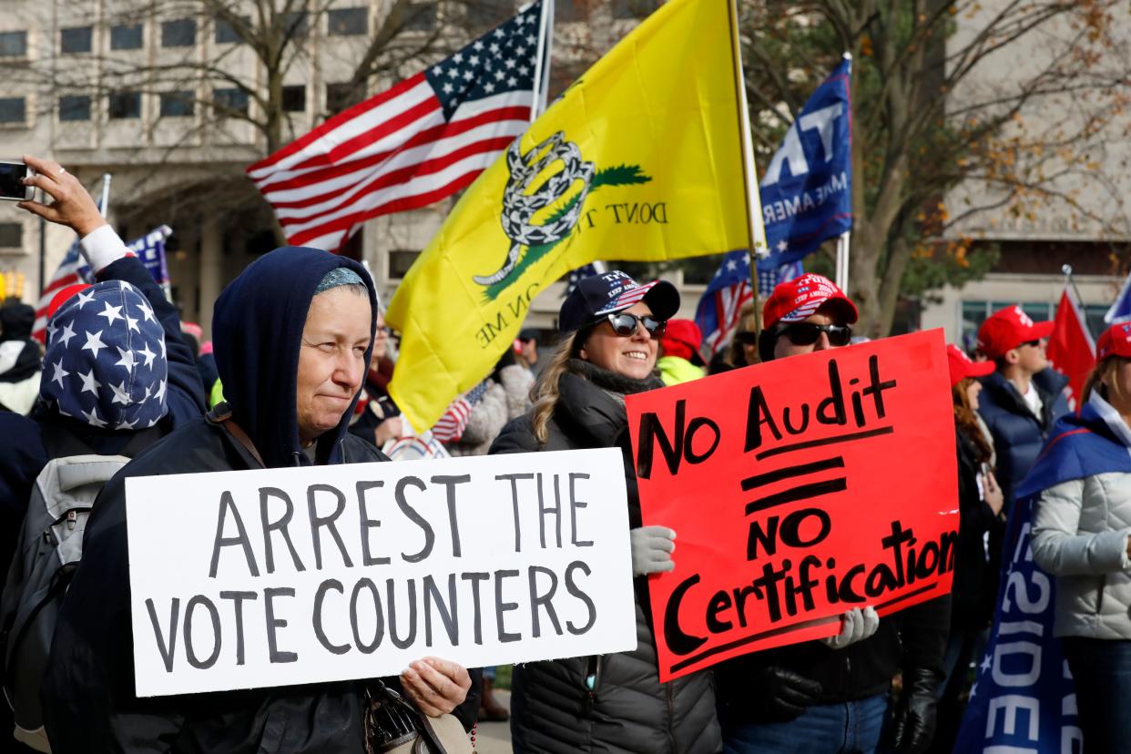 People gather at the Michigan State Capitol in Lansing for a "Stop the Steal" rally in support of President Trump on Nov. 14. (Photo by Jeff Kowalsky/AFP via Getty Images)