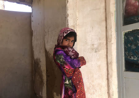 An Afghan refugee girl stands in her home in Kerman, Iran, October 23, 2016. REUTERS/Gabriela Baczynska