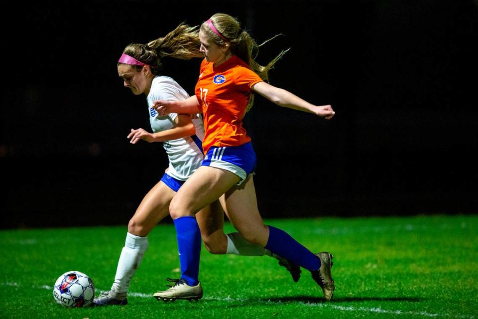 Gulfport’s Marissa Wingerter and Ocean Springs’ Ashton Rainey go for the ball during the 6A South State Championship game in Gulfport on Tuesday, Jan. 31, 2023.