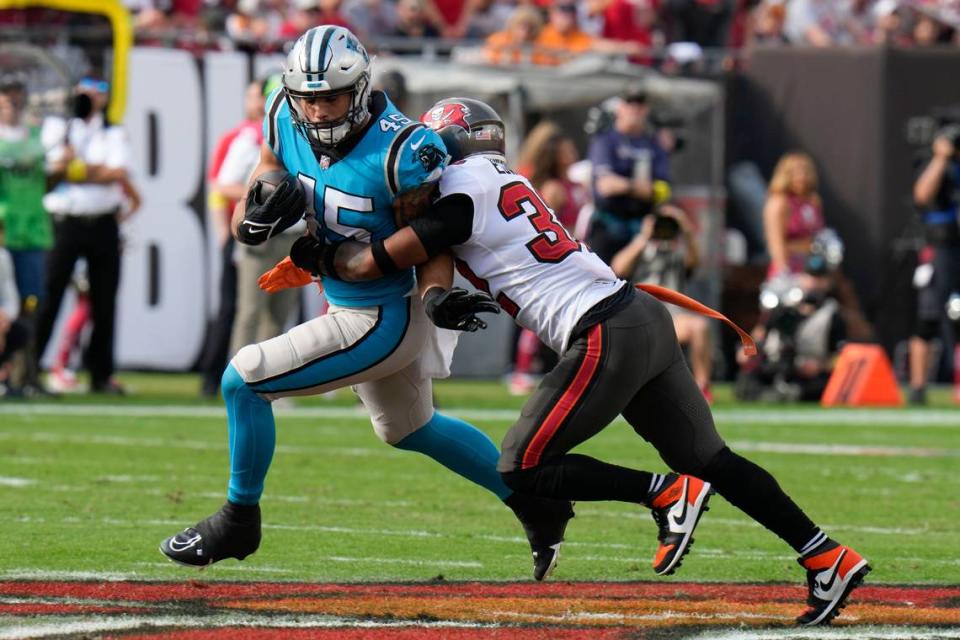 Carolina Panthers fullback Giovanni Ricci is tackled by Tampa Bay Buccaneers safety Mike Edwards during the second half of an NFL football game between the Carolina Panthers and the Tampa Bay Buccaneers on Sunday, Jan. 1, 2023, in Tampa, Fla. (AP Photo/Chris O’Meara)