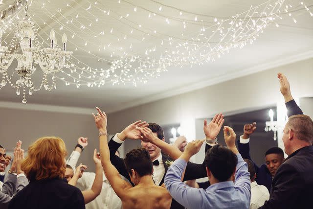 <p>Getty</p> stock photo of people celebrating at a wedding