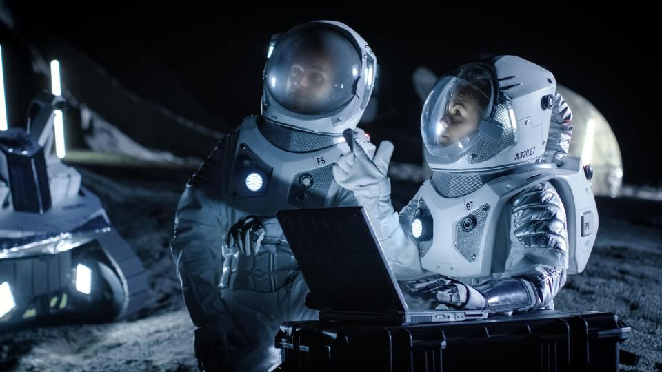 Two Astronauts Wearing Space Suits