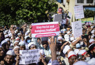 Supporters of Islamist parties protest after Friday prayers in Dhaka, Bangladesh, Friday, Oct. 30, 2020. Thousands of Muslims and activists marched through streets and rallied across Bangladesh’s capital on Friday against the French president’s support of secular laws that deem caricatures of the Prophet Muhammad as protected under freedom of speech. (AP Photo/Mahmud Hossain Opu)