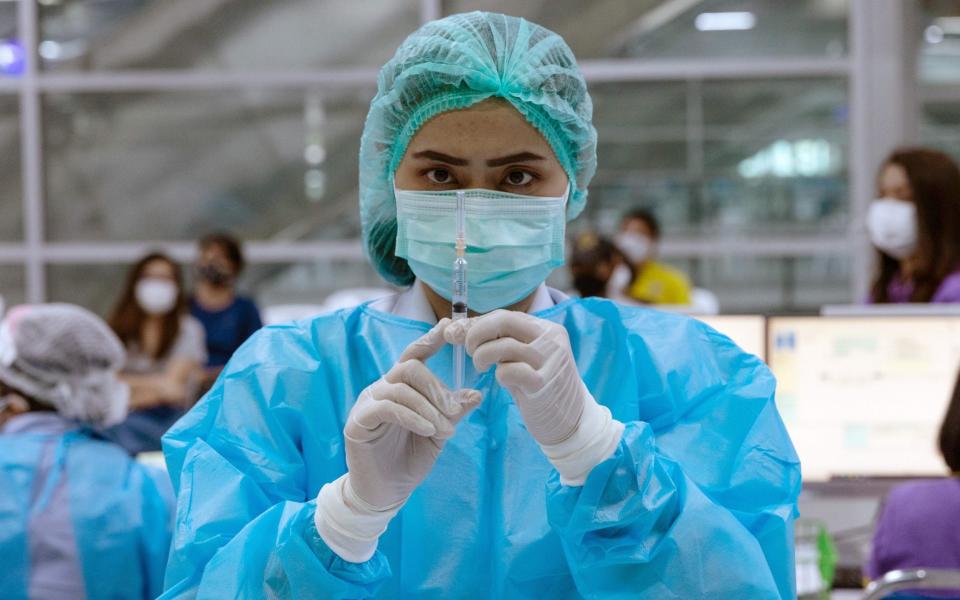 A health worker prepares to administer a dose of the Sinovac Covid-19 vaccine at a vaccination centre in Bangkok - Luke Duggleby /Bloomberg