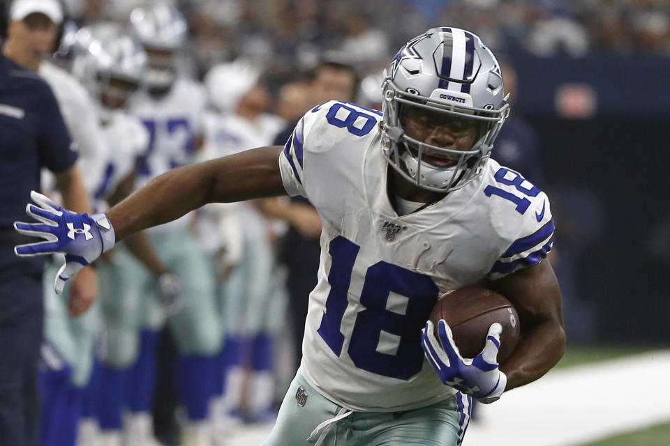 FILE - In this Sunday, Sept. 8, 2019, file photo, Dallas Cowboys wide receiver Randall Cobb (18) finds running room after catching a pass in the first half of a NFL football game against the New York Giants, in Arlington, Texas. Cobb still talks to his old quarterback regularly despite the receiver’s move to the Dallas Cowboys after spending his first eight seasons with Aaron Rodgers and the Green Bay Packers. While Cobb hadn’t spoken to Rodgers as of the middle of the week leading to their first game against each other Sunday, the trusty slot man didn’t seem too hung up on avoiding contact.(AP Photo/Ron Jenkins, File)