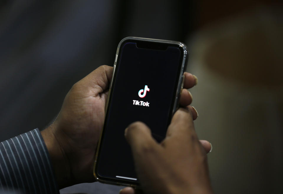 A man opens social media app 'Tik Tok' on his cell phone. Source: AP