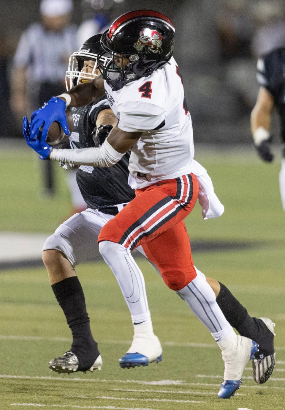 McKinley receiver Xavier Harris reels in a pass with defense from Perry's Vann Riordan Friday, September 8, 2023.