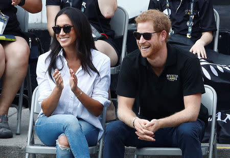 Britain's Prince Harry and his girlfriend actress Meghan Markle watch the wheelchair tennis event during the Invictus Games in Toronto, Ontario, Canada September 25, 2017. REUTERS/Mark Blinch