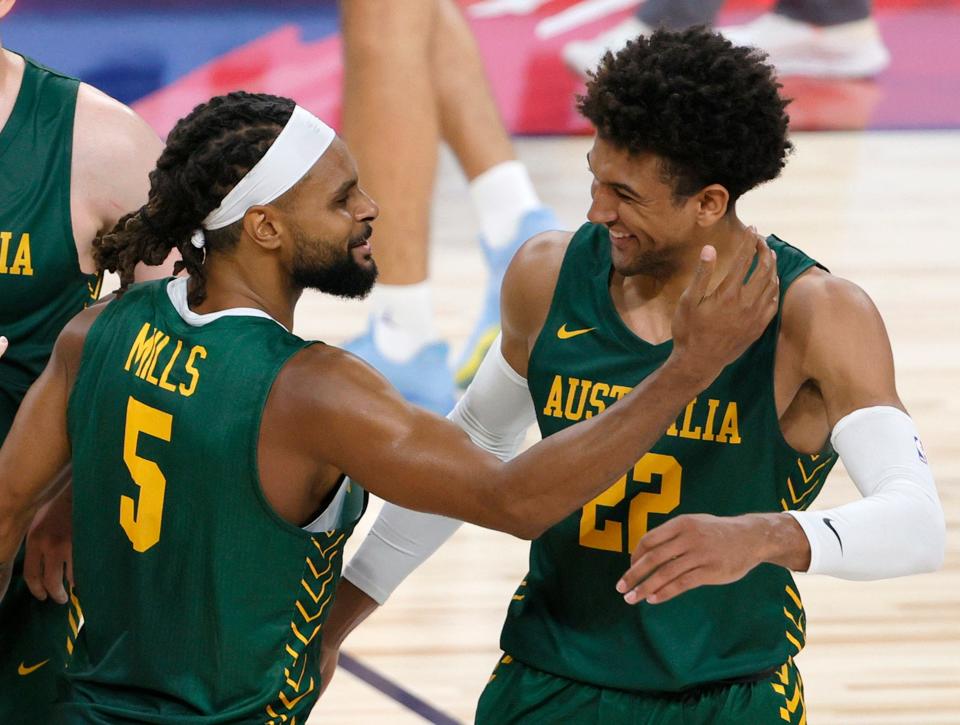Patty Mills and Matisse Thybulle, here celebrating an exhibition win for Australia are two of a plethora of NBA players suiting up to play at the Tokyo Olympics.