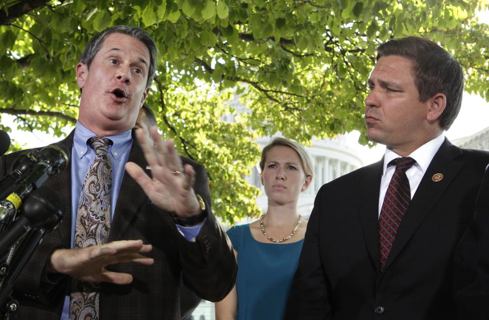 Senator David Vitter (R-LA) (L) and Representative Ron DeSantis (R-FL) hold a news conference on Capitol Hill in Washington to "urge House Republicans to include the 'No Washington Exemption from Obamacare' amendment in the Continuing Resolution" September 30, 2013. Democrats who control the U.S. Senate were confident that they would defeat Republicans' efforts to delay "Obamacare" health reforms on Monday and send a "clean" bill to keep the federal government operating back to the House of Representatives. REUTERS/Yuri Gripas (UNITED STATES - Tags: POLITICS BUSINESS)