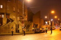 Police officers attend to the scene of a shooting at Poplar Row in Dublin, Ireland February 8, 2016. REUTERS/Clodagh Kilcoyne