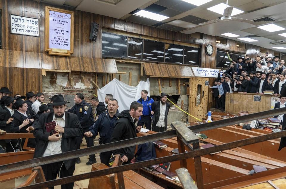 FILE - Hasidic Jewish students riot against New York Police officers who were called to inspect a secret tunnel dug under the synagogue by students, Monday, Jan. 8, 2024, in New York. A group of Hasidic Jewish worshippers were arrested amid a dispute over a secret tunnel built beneath the historic Brooklyn synagogue, setting off a brawl between police and those who tried to defend the makeshift passageway. (Bruce Schaff via AP, File)