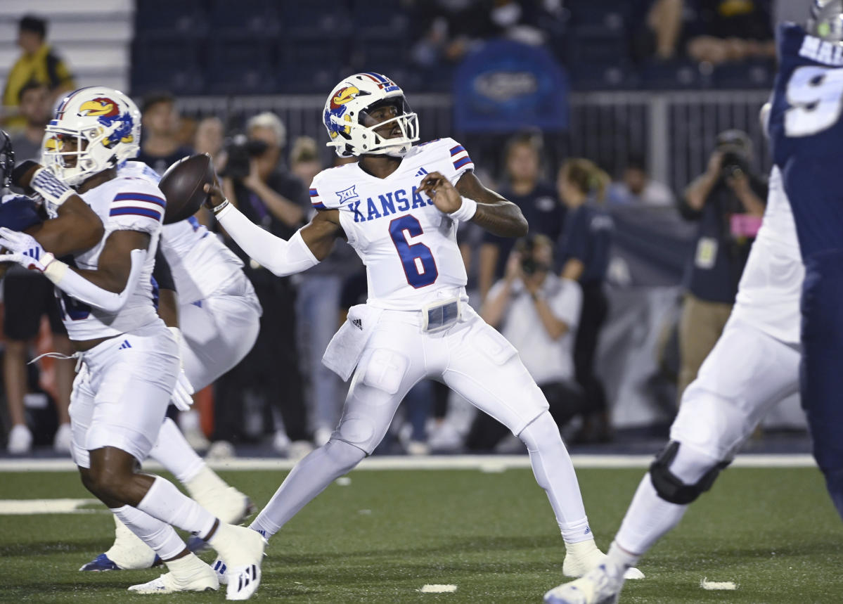 Neal runs for 3 TDs, Hinshaw Jr. adds runs for another to help Kansas beat  Nevada 31-24