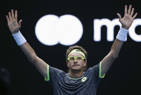 Tennis - Australian Open - Melbourne Park, Melbourne, Australia - 19/1/17 Uzbekistan's Denis Istomin celebrates after winning his Men's singles second round match against Serbia's Novak Djokovic. REUTERS/Issei Kato