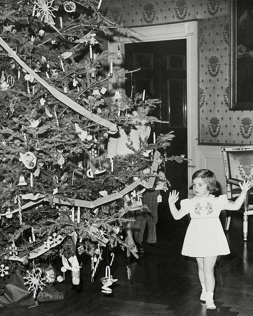 A young Caroline Kennedy dances near the Christmas tree, December 1961.