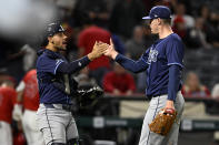 Tampa Bay Rays catcher Rene Pinto, left, congratulates pitcher Pete Fairbanks after the Rays defeated the Los Angeles Angels in a baseball game in Anaheim, Calif., Tuesday, April 9, 2024. (AP Photo/Alex Gallardo)