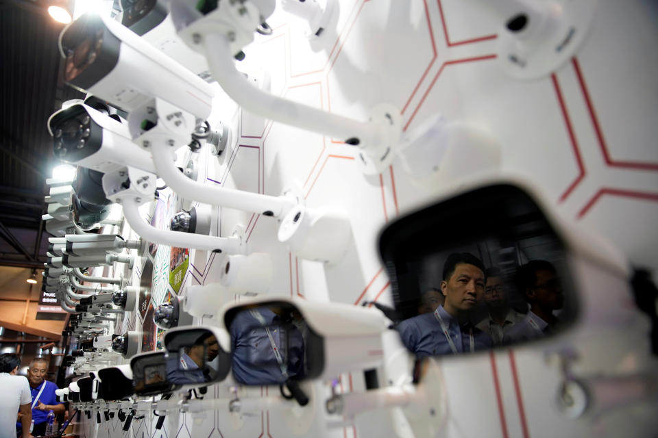 A man is reflected on surveillance cameras at the annual Huawei Connect event in Shanghai, China September 18, 2019. REUTERS/Aly Song     TPX IMAGES OF THE DAY