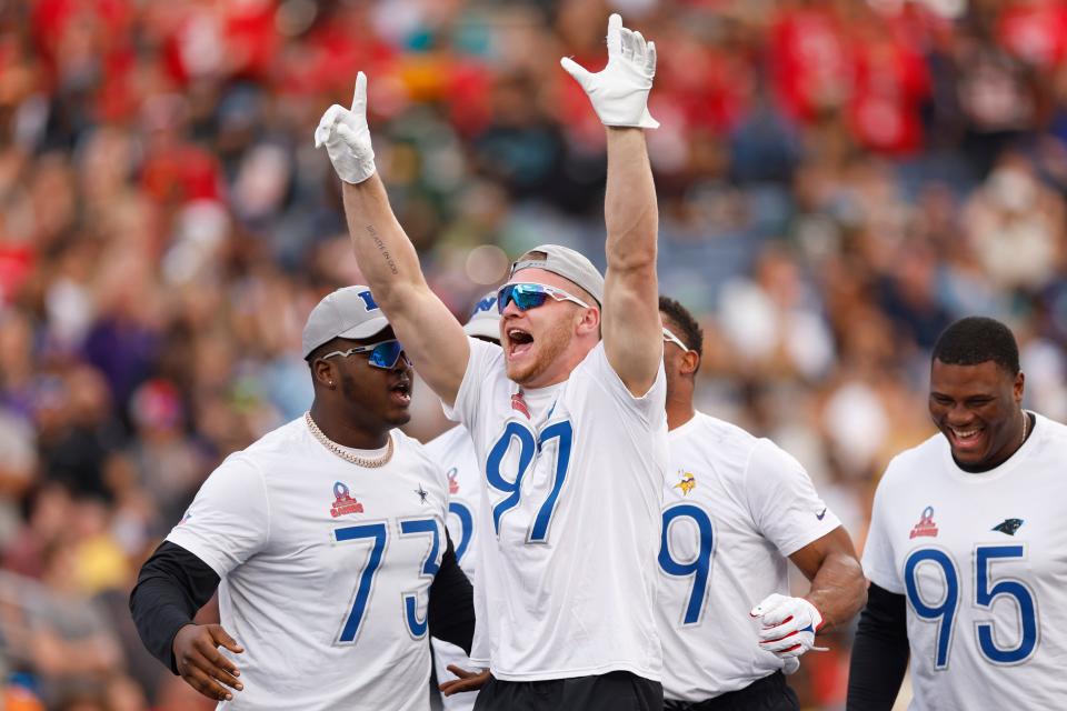 Detroit Lions' Aidan Hutchinson celebrates with teammates after winning a tug-of-war challenge during the NFL Pro Bowl Games at Camping World Stadium on Feb. 4, 2024 in Orlando.