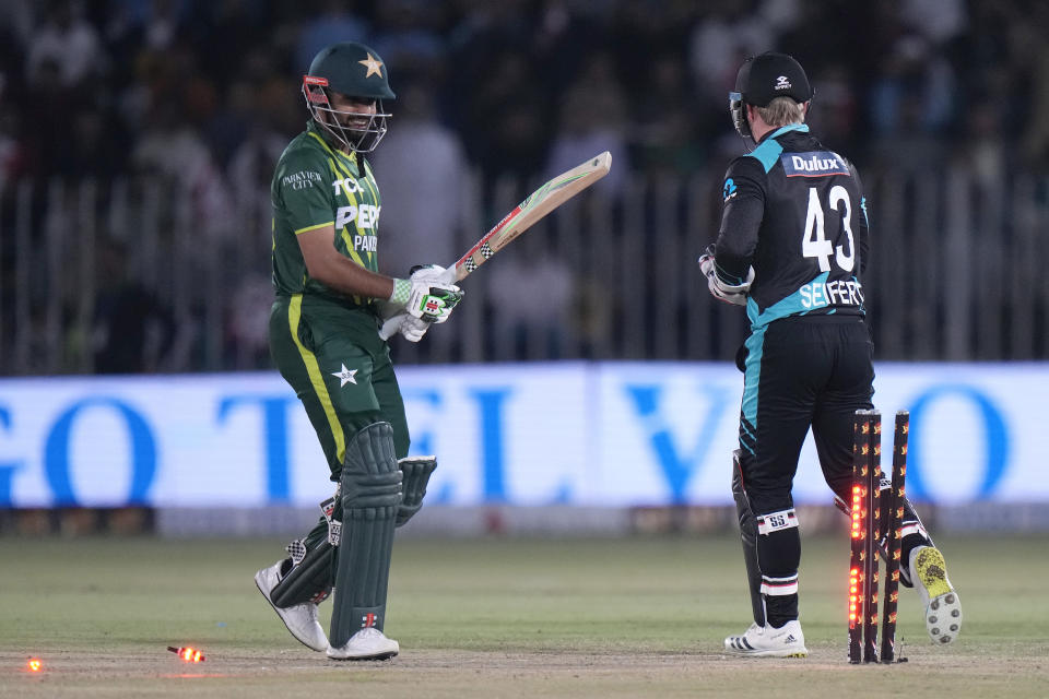 Pakistan's Babar Azam, left, reacts after he stump out by New Zealand's Tim Seifert, right, during the second T20 international cricket match between Pakistan and New Zealand, in Rawalpindi, Pakistan, Saturday, April 20, 2024. (AP Photo/Anjum Naveed)