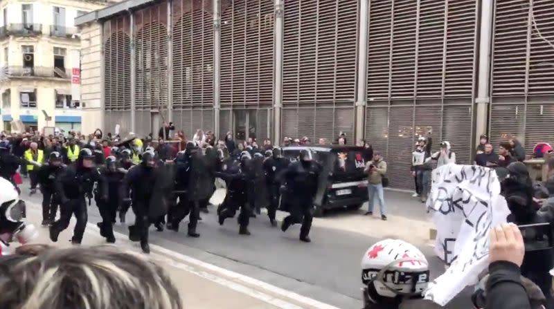 Police charge towards demonstrators during protests against French government's pensions reform plans, in Montpellier