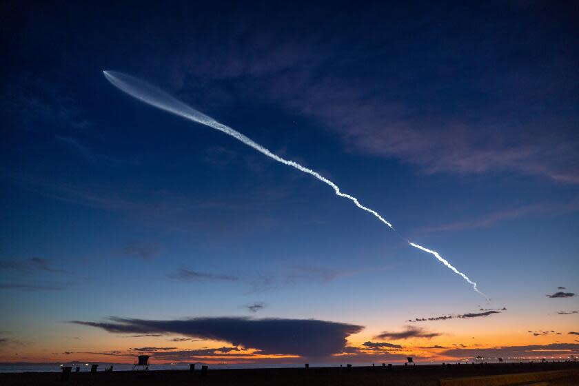 Huntington Beach, CA - March 18: The launch of SpaceX Falcon 9 rocket with 22 Starlink satellites is viewed from Huntington Beach at dusk after taking off from Vandenberg Space Force Base Monday, March 18, 2024. (Allen J. Schaben / Los Angeles Times)