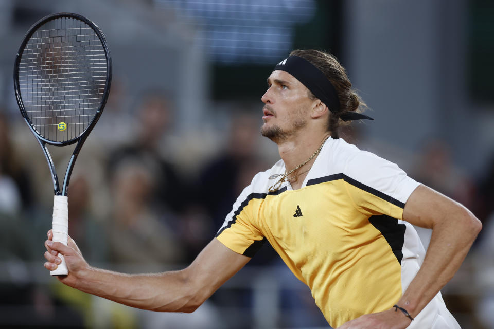 Germany's Alexander Zverev runs to play a shot against Australia's Alex De Minaur during their quarterfinal match of the French Open tennis tournament at the Roland Garros stadium in Paris, Wednesday, June 5, 2024. (AP Photo/Jean-Francois Badias)