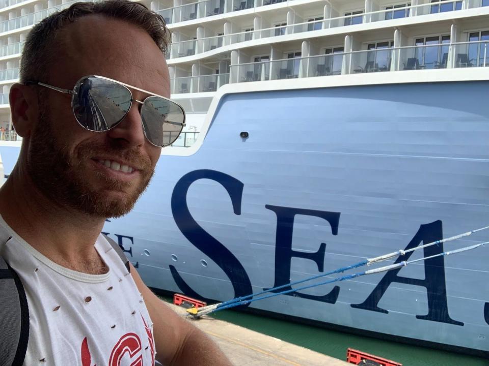 the writer posing with the cruise ship