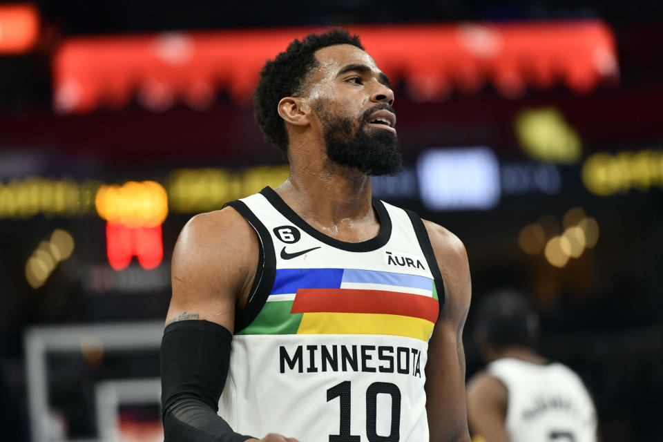 Minnesota Timberwolves guard Mike Conley (10) plays in the first half of an NBA basketball game against the Memphis Grizzlies, Friday, Feb. 10, 2023, in Memphis, Tenn. (AP Photo/Brandon Dill)