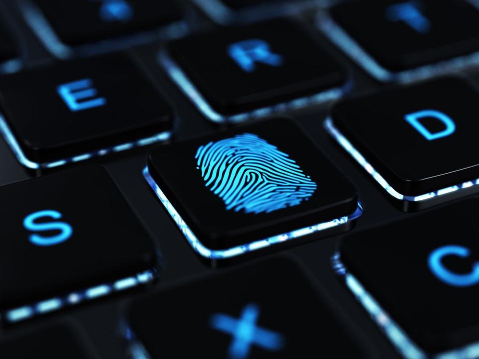 A fingerprint on a keyboard key.