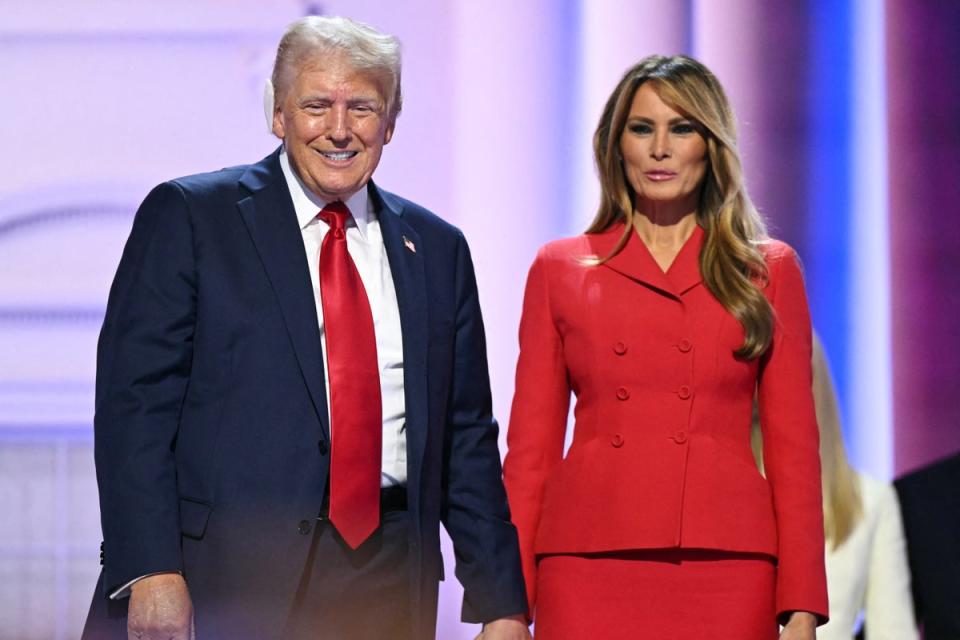 Donald Trump with Melania Trump on stage after he accepted his party's nomination on the last day of the Republican National Convention on July 18 2024 (AFP via Getty Images)