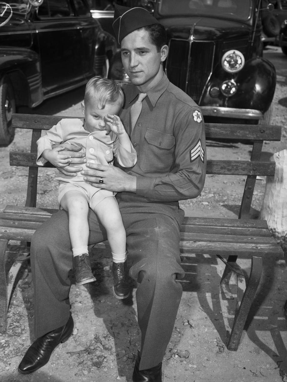 April 7, 1945: The Forest Park Zoo opened Sunday to a big crowd. Enjoying his visit was blonde-haired, blue-eyed Lynn Curtis Bender. The 2-year-old fellow rubs his tired eyes as he sits with his father, Sgt. William J. Bender, on a bench. The Benders are natives of Fort Wayne, Indiana, and Sunday was their first visit to the Forest Park Zoo.