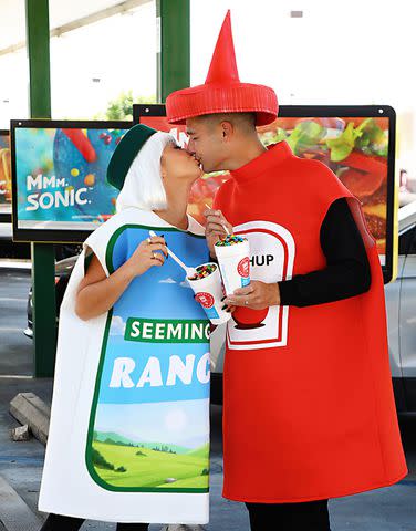 <p>Sara Jaye/Getty</p> Sarah Hyland and Wells Adams, in costume as Seemingly Ranch and Ketchup.