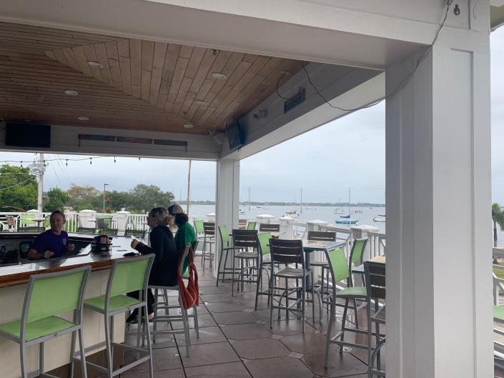 Grab a seat at the bar, or score a table along the railing on the second-floor rooftop deck at Ryan&#39;s Village Pizza &amp; Pub in Cocoa Village.