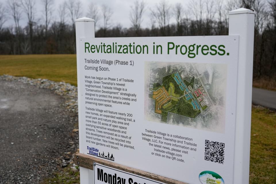 A sign describes the ongoing Trailside Village project in Green Township.