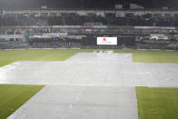 Pitch covers with sheets as rain stop the play of first T20 cricket match between Pakistan and New Zealand, in Rawalpindi, Pakistan, Thursday, April 18, 2024. (AP Photo/Anjum Naveed)