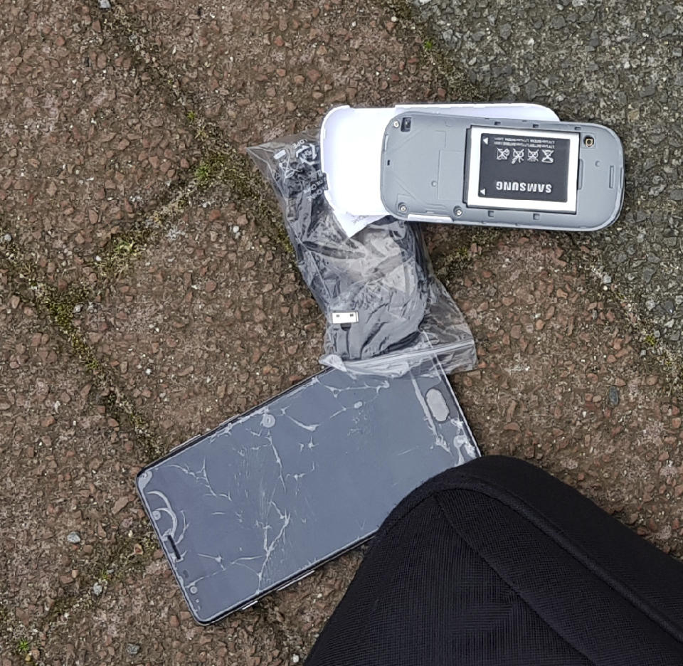 FILE - In this Thursday Oct. 4, 2018 file photo released by the Dutch Defense Ministry, one of the many phones belonging to four Russian officers of the Main Directorate of the General Staff of the Armed Forces of the Russian Federation (GRU) is seen after one of the four officers tried to destroy it when they were caught on April 13, 2018. After seeing its secrets increasingly exposed by determined journalists and Kremlin critics, the Russian military intelligence agency known as the GRU endured another hit Friday, Oct. 26: A new report details misbehavior, sloppiness and bizarre bureaucratic decisions that allowed a Russian journalist to identify multiple alleged GRU officers. While no one is suspected of grave wrongdoing, journalist Sergei Kanev says he wants to call attention to problems within an organization that he feels has crossed a line beyond traditional spying into unchecked violence and foreign interference. (Dutch Defense Ministry via AP, file)