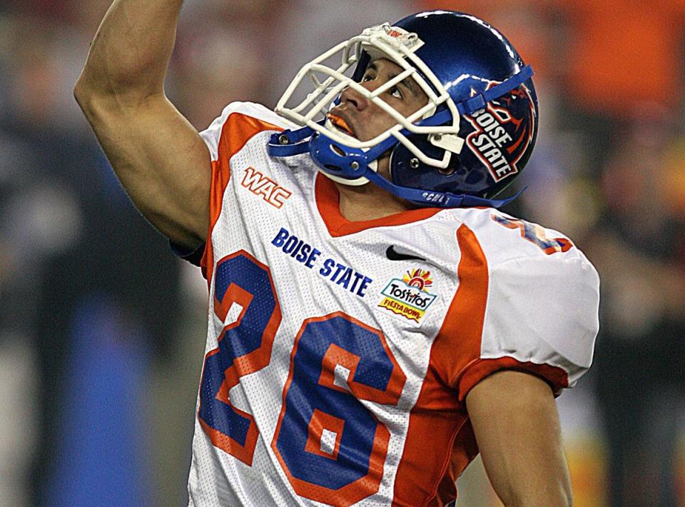 GLENDALE, AZ - JANUARY 1, 2007:  Ia Falo, #26 defensive back of the Boise State University Broncos football team celebrates the play against the University of Oklahoma Sooners during the 2007 Tostitos Fiesta Bowl game at the University of Phoenix Stadium in Glendale, Arizona on January 1, 2007.  The Broncos won 43-42. (Photo by Steve Conner/Boise State University/Getty Images)