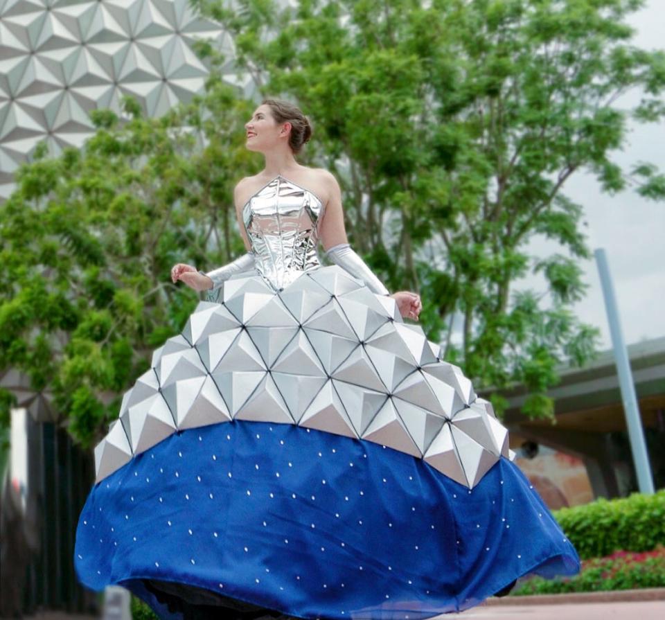 Disney fan Sky dresses as Spaceship Earth at Epcot.