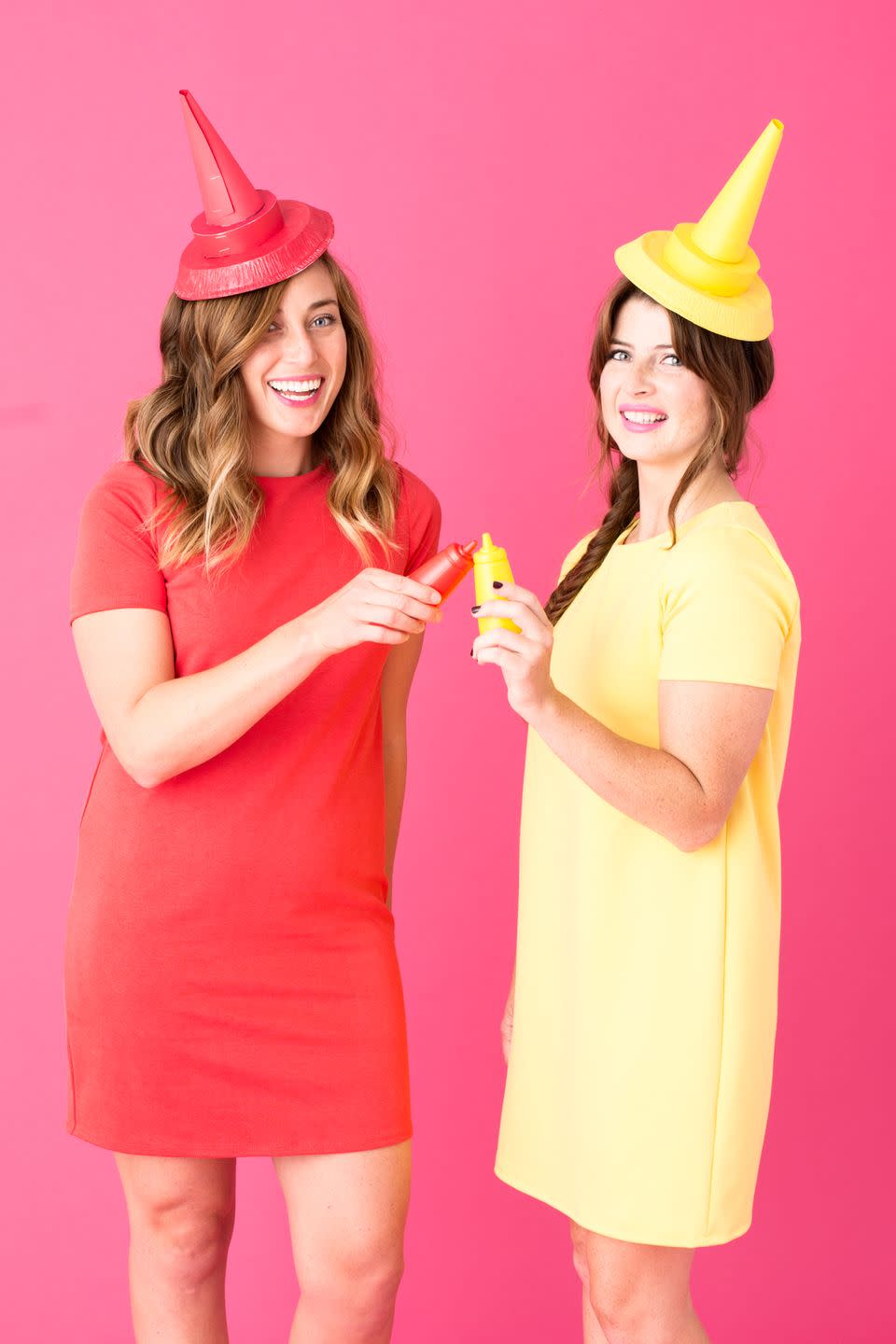 <p>This is yet another costume that can be pulled together with clothes you already have in your closet and a few craft supplies (the hats are made of pie tins and colored cardstock).</p><p><em><a href="https://studiodiy.com/diy-hot-dog-costume/" rel="nofollow noopener" target="_blank" data-ylk="slk:Get the tutorial at Studio DIY »;elm:context_link;itc:0;sec:content-canvas" class="link ">Get the tutorial at Studio DIY »</a></em></p>