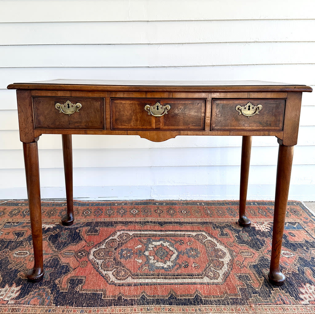 <p><a href="https://largercross.com/collections/one-of-a-kind/products/antique-queen-anne-walnut-side-table" rel="nofollow noopener" target="_blank" data-ylk="slk:Shop Now;elm:context_link;itc:0;sec:content-canvas" class="link rapid-noclick-resp">Shop Now</a></p><p>Larger Cross</p><p>largercross.com</p><p>$2350.00</p>