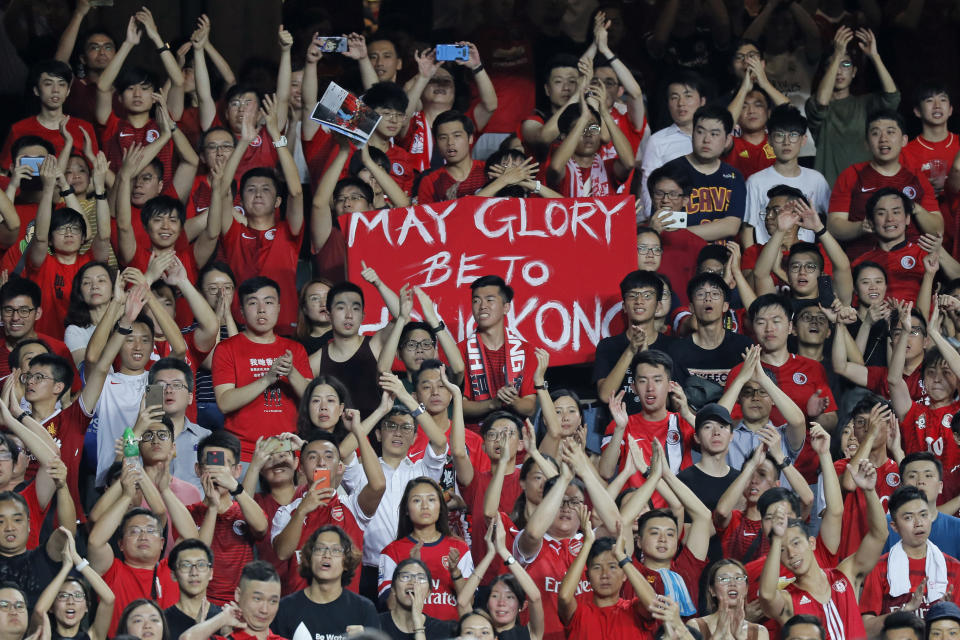 Hong Kong soccer fans sing during the FIFA World Cup Qatar 2022 and AFC Asian Cup 2023 Preliminary Joint Qualification Round 2 soccer match between Hong Kong and Iran, in Hong Kong, Tuesday, Sept. 10, 2019. The crowd broke out into "Glory to Hong Kong," a song reflecting their campaign for more democratic freedoms in the semi-autonomous Chinese territory. (AP Photo/Kin Cheung)