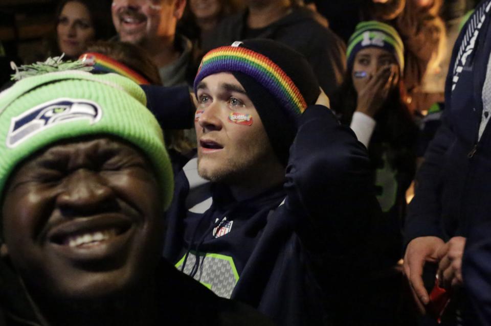 Seattle Seahawks fans react after their team lost the Super Bowl XLIX to the New England Patriots, in Seattle, Washington February 1, 2015. The New England Patriots beat the Seahawks 28-24 to win the NFL championship, Sunday in Glendale, Arizona. REUTERS/Jason Redmond (UNITED STATES - Tags: SPORT FOOTBALL)