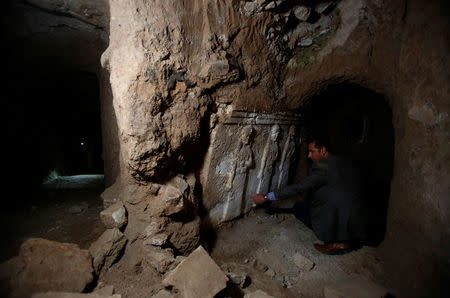 Archaeologist Musab Mohammed Jassim shows artefacts and archaeological pieces in a tunnel network running under the Mosque of Prophet Jonah, Nabi Yunus in Arabic, in eastern Mosul, Iraq March 9, 2017. Picture taken March 9, 2017. REUTERS/Suhaib Salem